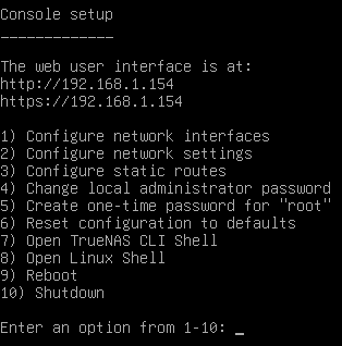 Gray text console on black. Gives information on accessing the web interface, configuring network settings, setting a one-time root password, accessinng the TrueNAS or Linux shell, and options to reboot and shutdown.